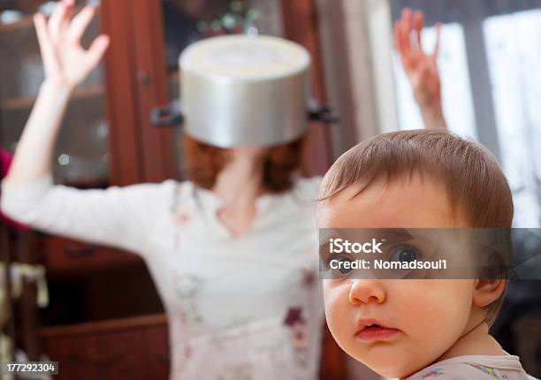 Scared Baby Against Crazy Mother Stock Photo - Download Image Now - Bizarre, Humor, Mother