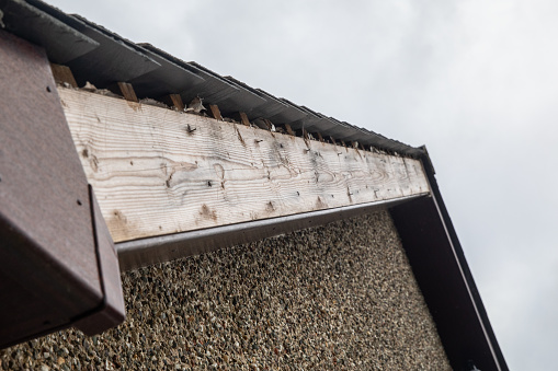 Storm damage to the plastic cladding freefoam - wind stripping off the facia from the eaves of this residential property.