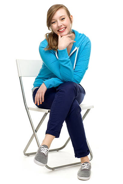 istock Young woman sitting on a chair 177292845