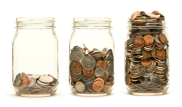 istock Three coin savings jars each fuller than the last 177292897