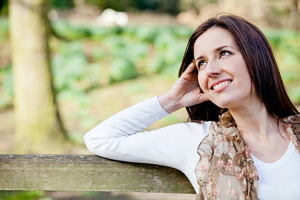 istock Pensive woman at the park 177293114