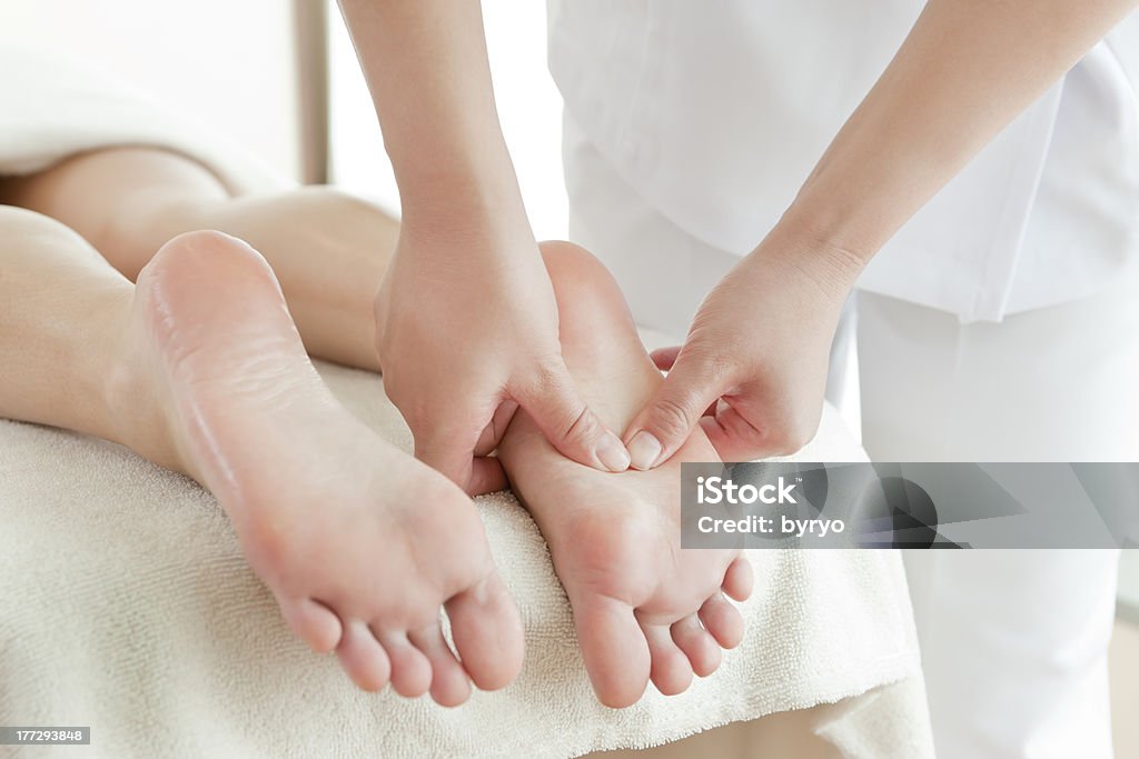 The woman who receives a beauty treatment salon Beauty treatment salon Reflexology Stock Photo