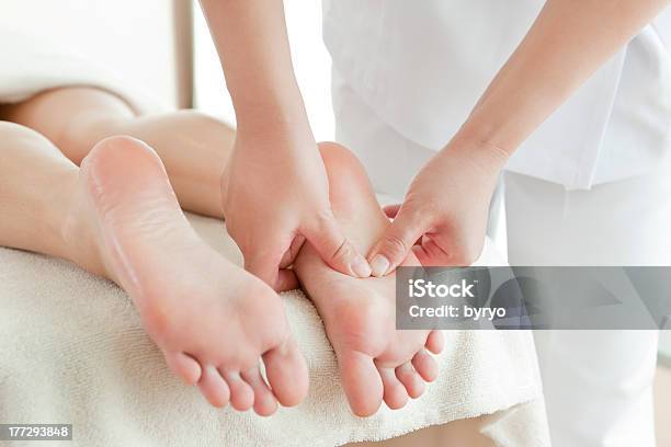 The Woman Who Receives A Beauty Treatment Salon Stock Photo - Download Image Now - Reflexology, Foot Massage, Massaging