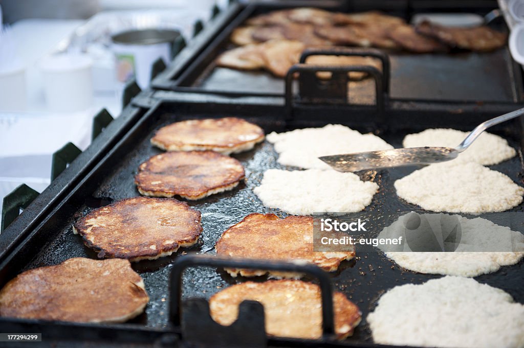 Tasty Pancakes Grill A Closeup shot of a cook turning pancakes on a grill. Baking Stock Photo