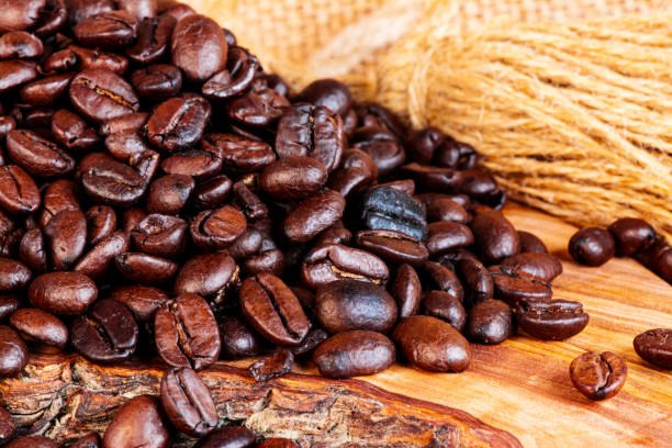 istock Freshly baked  dried coffee beans on background 1772943764