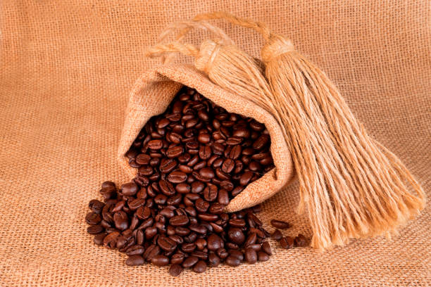 istock Freshly baked  dried coffee beans on background 1772943776