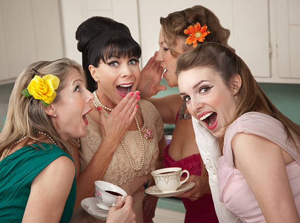 Woman Whispering Secret Group of four retro fashion housewives tell secrets in the kitchen retro 1950s kitchen stock pictures, royalty-free photos & images