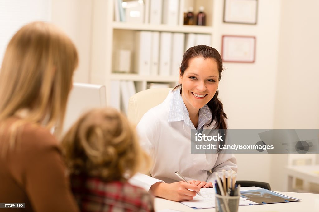 Mother and child girl visit pediatrician office Mother and child girl visit pediatrician office healthcare specialist Adult Stock Photo
