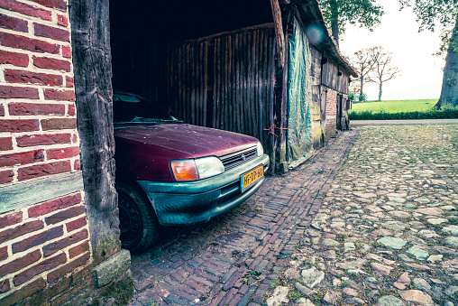 Vasse, Netherlands - May 30, 2023: Toyota car parked in an old shed