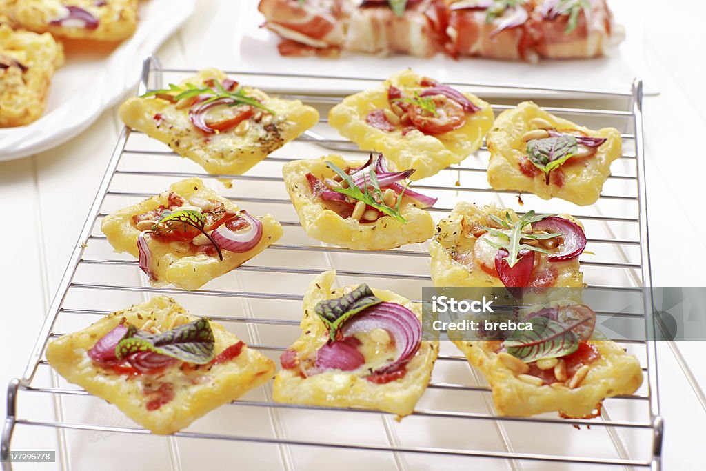 Puff pastry "Puff pastry with cheese, tomato and vegetables" Antipasto Stock Photo