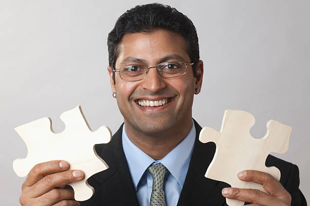 istock Businessman putting the puzzle together 177295862