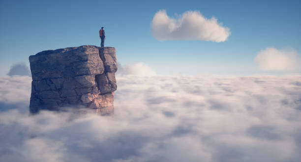 istock Hiker on top of a mountain over a cloud. 1772960589