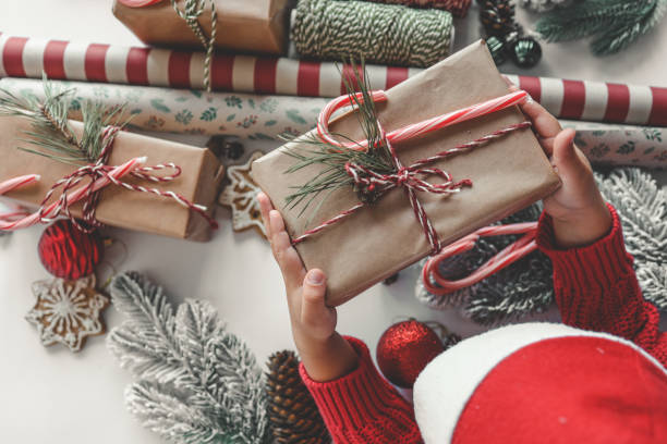 istock Child Santa with a Christmas gift in his hands 1772961693