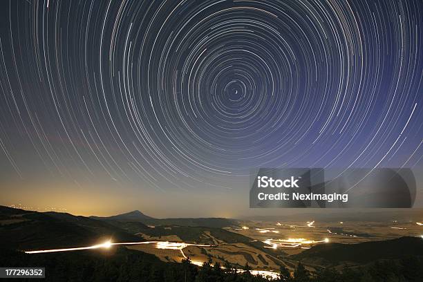 Startrail Over Valley Stock Photo - Download Image Now - Astronomy, Backgrounds, Horizontal