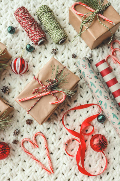 istock Christmas gifts and wrapping paper top view 1772965120