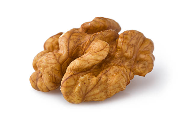 istock Extreme close-up of walnut seed isolated on white 177296758