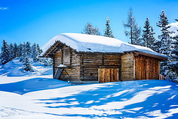 istock Snowcapped cottage in winter 177296780