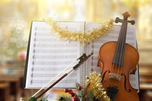 istock Violin with christmas decoration with religious temple background 1772967865