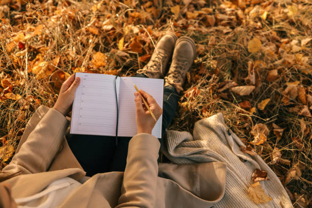 istock Girl with paper planner outdoors, autumn concept 1772969985