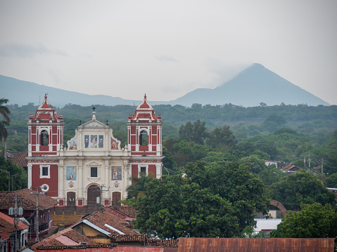 A high angle view of a church and the mountains. Rainforest