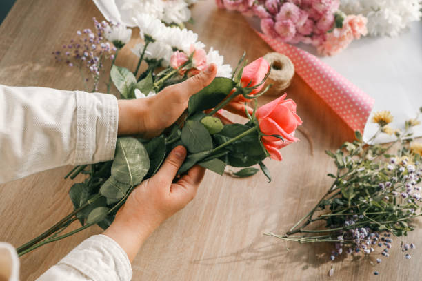 istock Florist at work. Woman making autumn floral decorations 1772976521