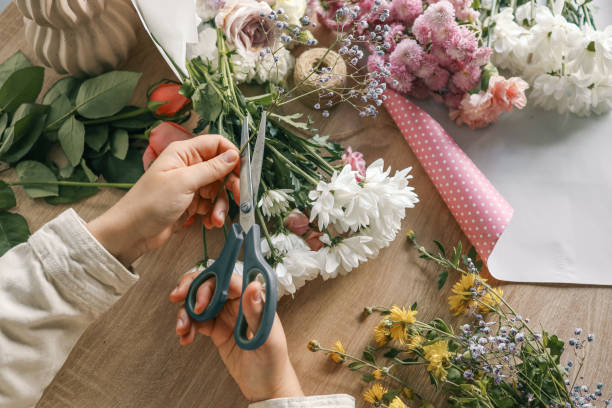 istock Florist at work. Woman making autumn floral decorations 1772976536