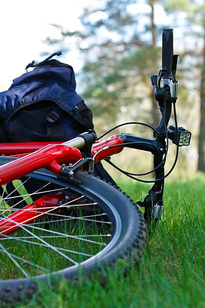 istock Bike and Backpack Close-up Lying on Green Grass 177298065