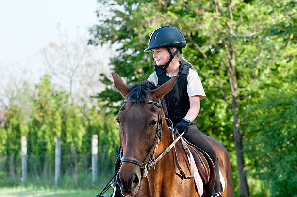 young girl riding a horse