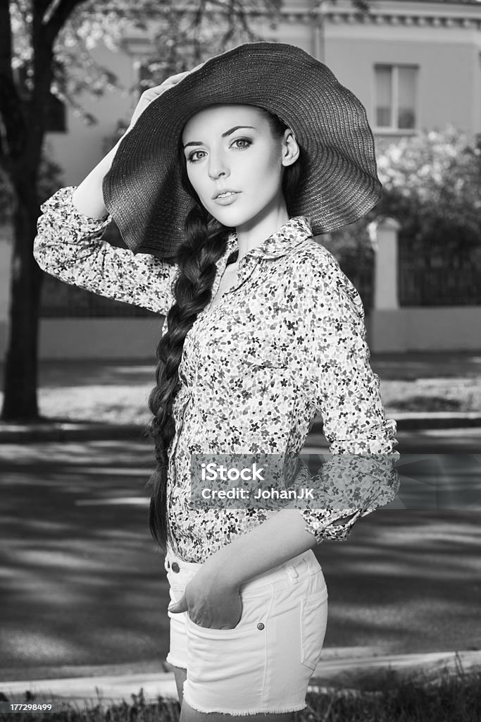 sunny day portrait of a beautiful girl walking down the street Adult Stock Photo