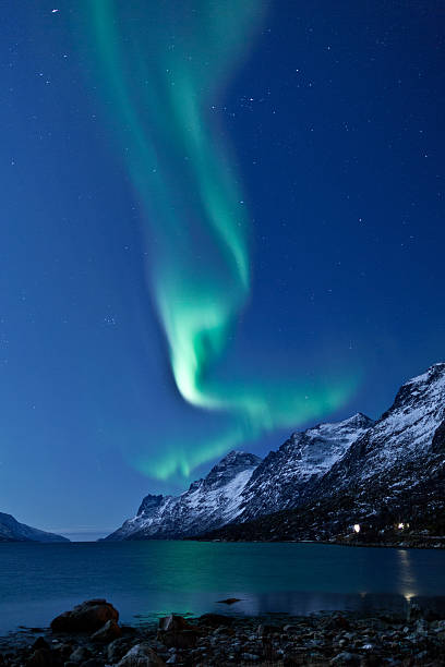istock Aurora Borealis curls above mountains and sea 177298682