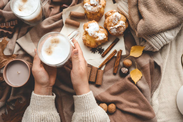 istock Cup of coffee in hands, cozy autumn 1772987027