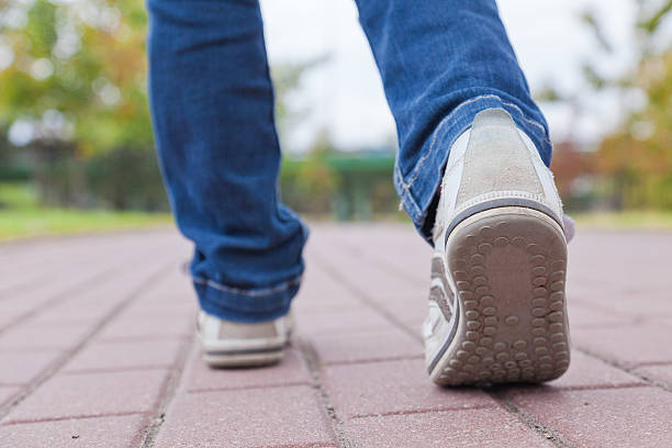 istock Walking in sport shoes on pavement 177298928