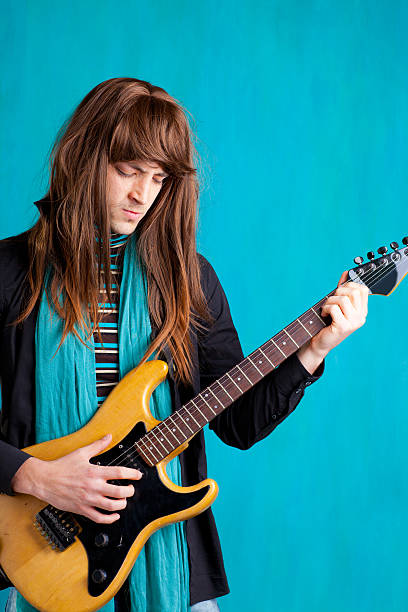 istock Hard rock seventies electric guitar player man 177298976