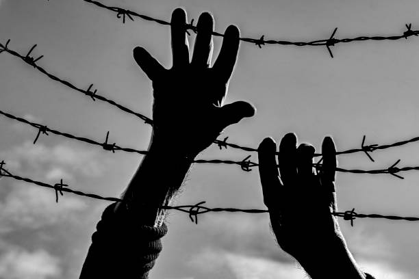 Silhouette of a prisoner's hands