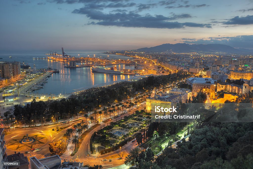 Malaga city lights - aerial view "Twilight aerial view of Malaga city, the second most populous city of Andalusia and the sixth largest in Spain. Malaga's history spans about 2,800 years, making it one of the oldest cities in the world." Aerial View Stock Photo