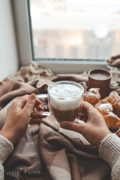 istock Cup of coffee in hands, cozy autumn 1772994099