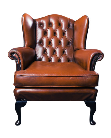 The old leather armchair on a white background. Saved clipping path.