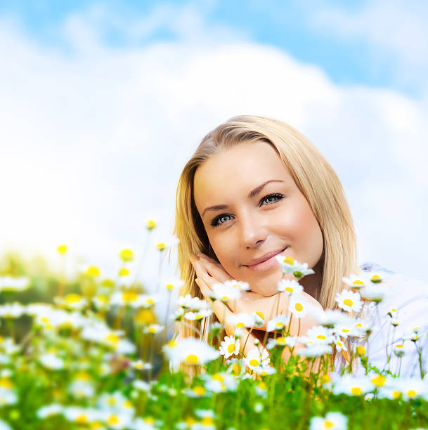 istock Beautiful woman enjoying daisy field and blue sky 177300536