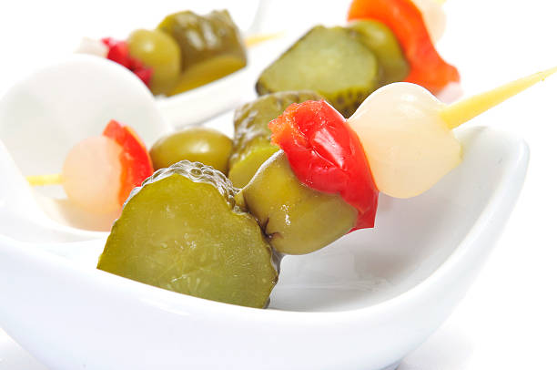 Spanish flags "spanish banderillas, skewers with pickling olives, garlic, pickles, onion and red pepper" banderilla stock pictures, royalty-free photos & images