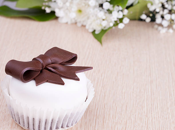 White cake with chocolate bow