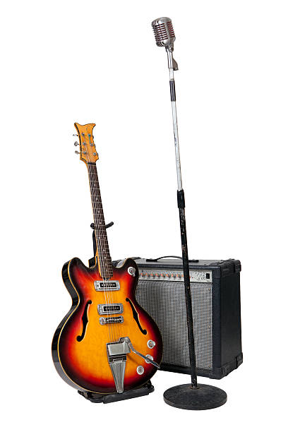 istock Vintage microphone on stand with guitar and amplifier 177301686