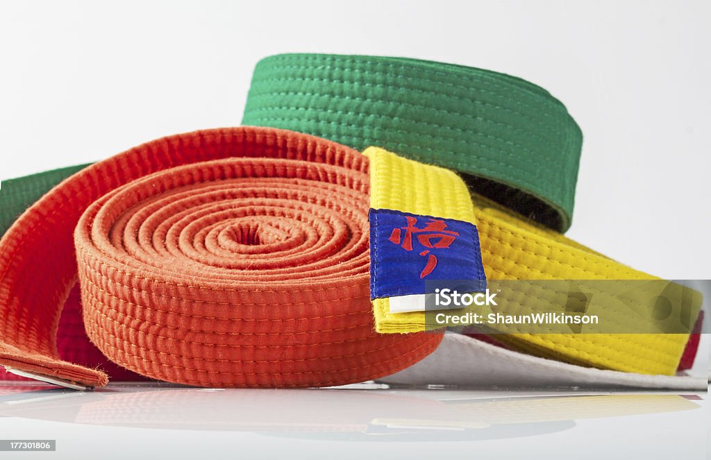 Karate Belts A collections of Karate belts agaist a white background Armed Forces Rank Stock Photo