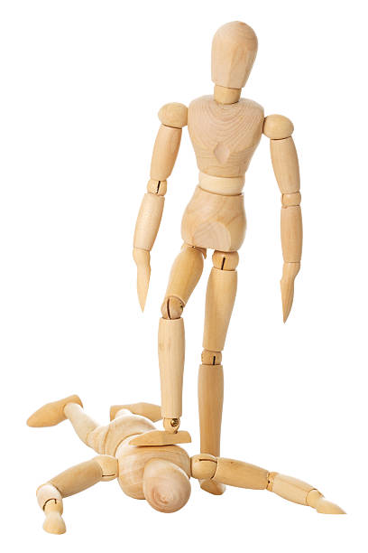 istock Wooden doll stands on another one 177302025