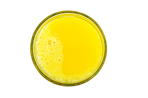 Orange juice isolated on white background top view
