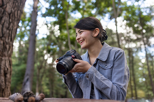 Nature photographer with her camera in hand