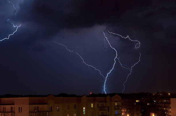 Lightning over housing estate stock photo