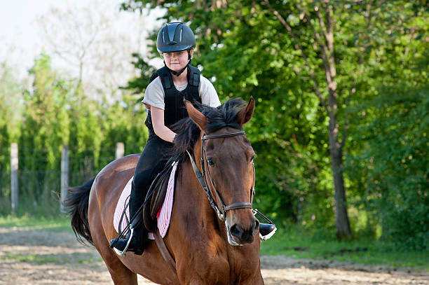 istock girl riding a horse 177302739