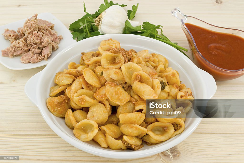 orecchiette pasta with tuna sauce orecchiette pasta with tuna sauce and its ingredients Balance Stock Photo