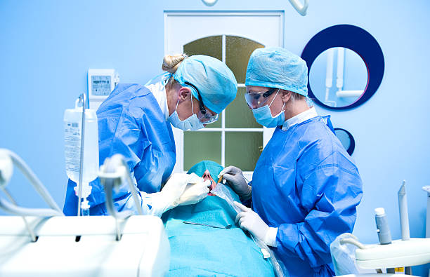 Dental implantation procedure stock photo