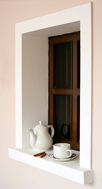 istock Coffee pot and a cup on the window sill 177304918
